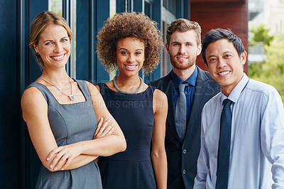 Buy stock photo Portrait of a group of happy young professionals standing together outside
