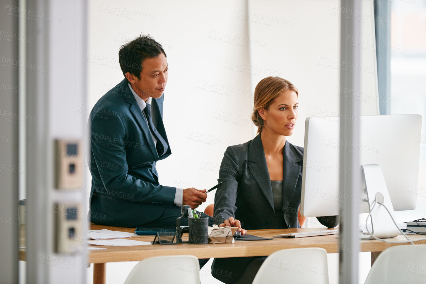 Buy stock photo Shot of corporate businesspeople in the office