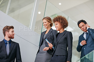 Buy stock photo Cropped shot of a group of businesspeople having a discussion in a modern office