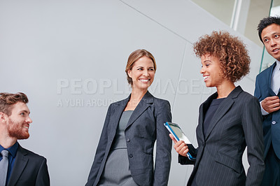 Buy stock photo Cropped shot of a group of businesspeople having a discussion in a modern office