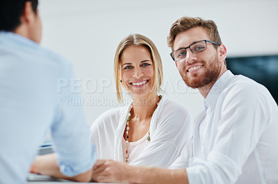 Buy stock photo Portrait of two business colleagues sitting together during a meeting
