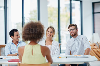 Buy stock photo Shot of a woman being interviewed by a team of businesspeople