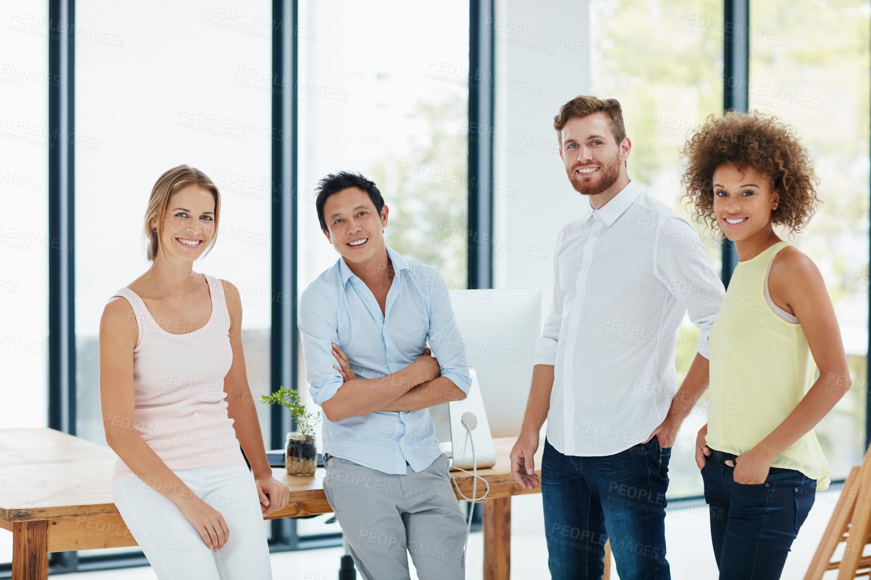 Buy stock photo Portrait of a group of businesspeople standing together in their office