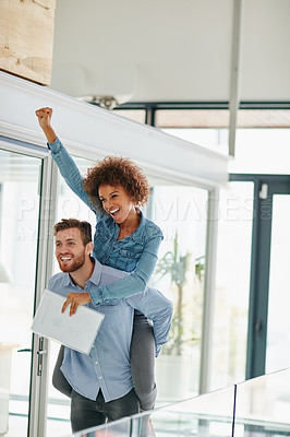Buy stock photo Cropped shot of a young businessman piggybacking a colleague in an office