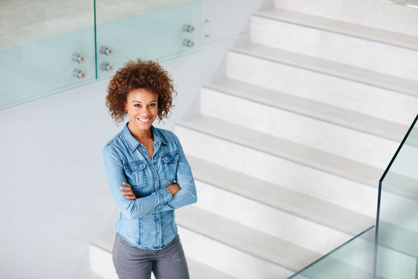 Buy stock photo Portrait of a confident young businesswoman standing in an office