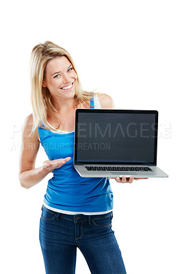 Buy stock photo Shot of a young woman holding a laptop against a white background