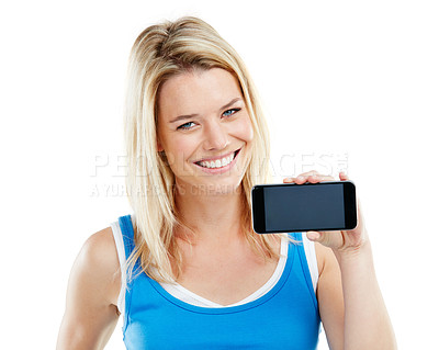 Buy stock photo Shot of a young woman holding a cellphone against a white background