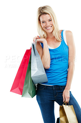 Buy stock photo Studio shot of an attractive young woman holding shopping bags