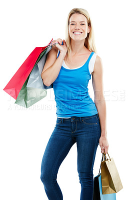 Buy stock photo Studio shot of an attractive young woman holding shopping bags