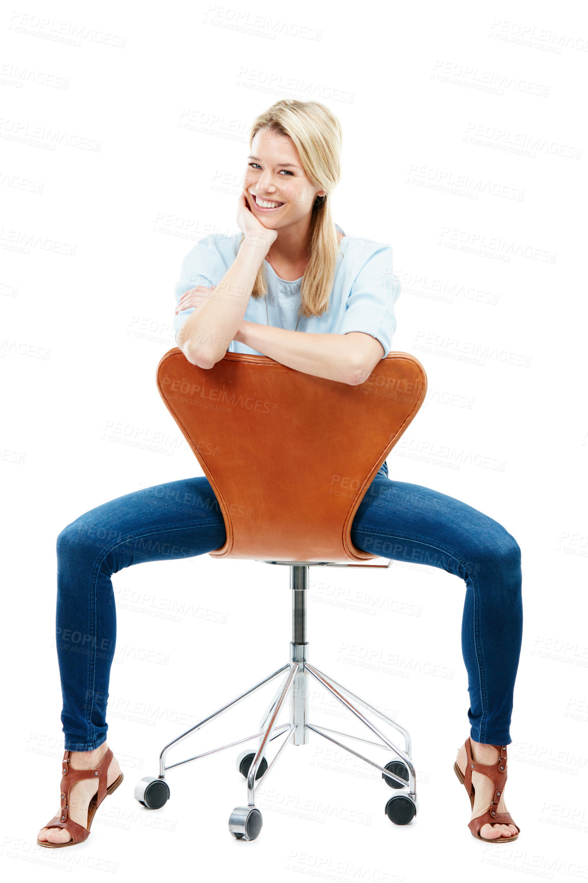 Buy stock photo Studio portrait of a happy young woman sitting on a chair against a white background