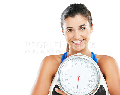 Buy stock photo Portrait of a sporty young woman holding a scale against a white background