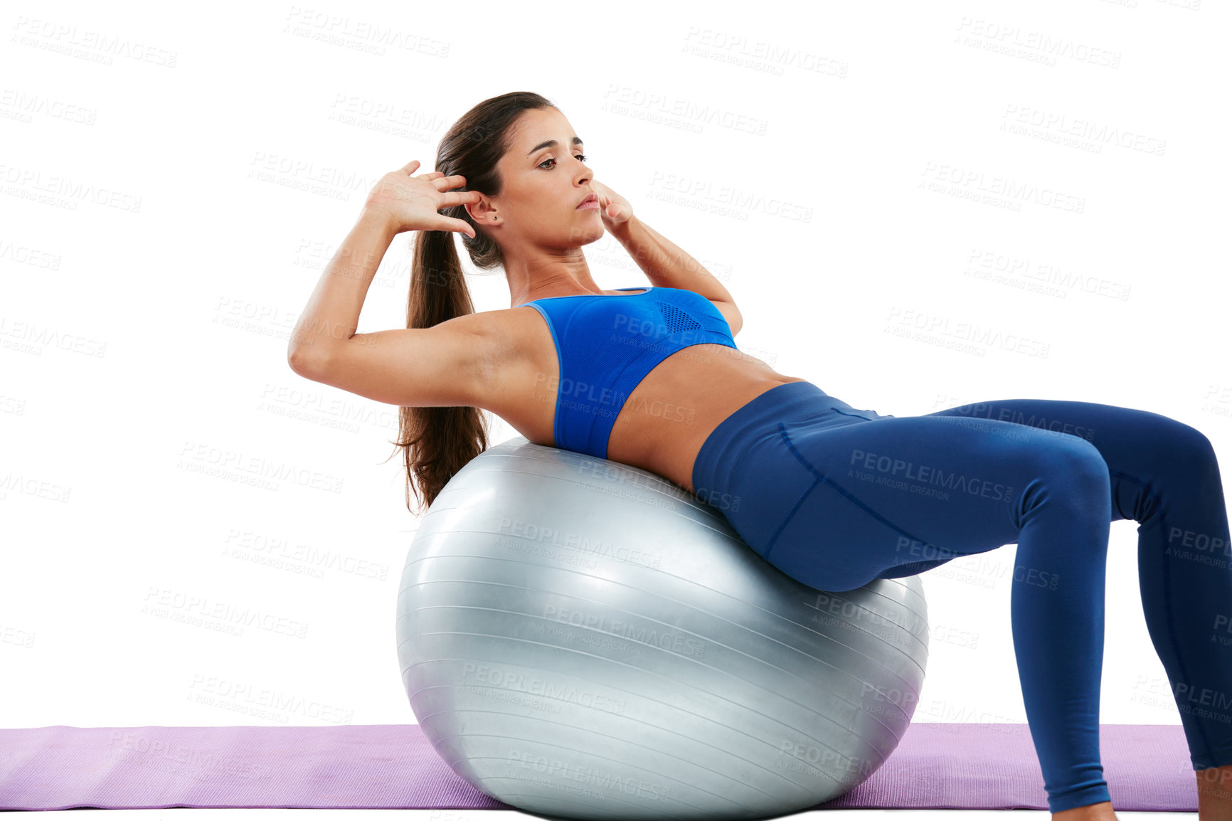 Buy stock photo Shot of a sporty young woman practising yoga against a white background