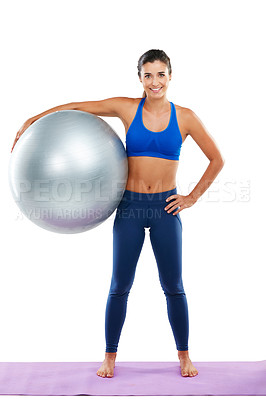 Buy stock photo Portrait of a sporty young woman holding an exercise ball against a white background