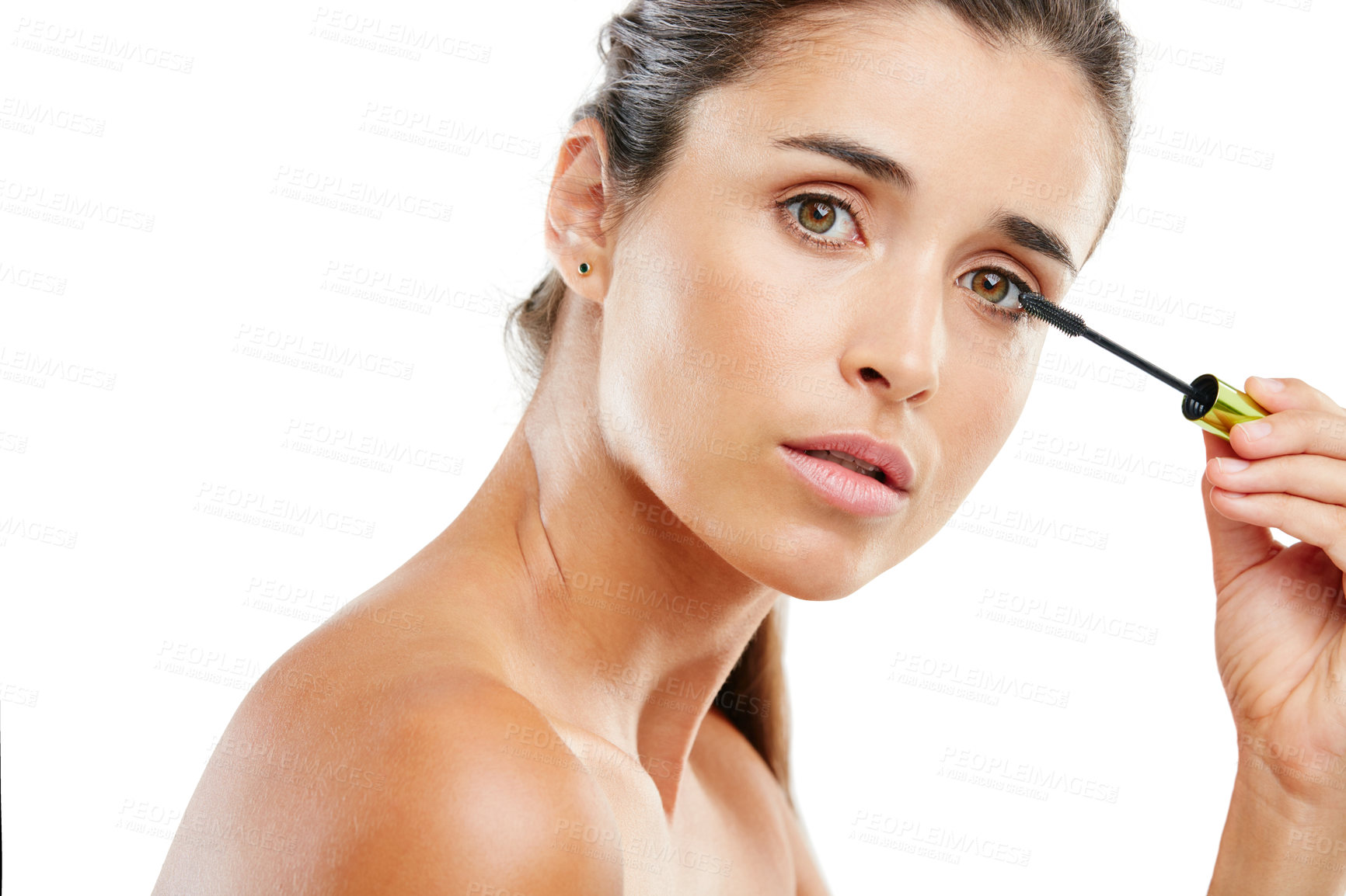 Buy stock photo Studio portrait of a beautiful young woman applying mascara against a white background