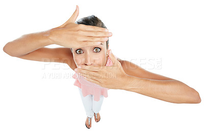 Buy stock photo Studio portrait of a young woman partially covering her face against a white background