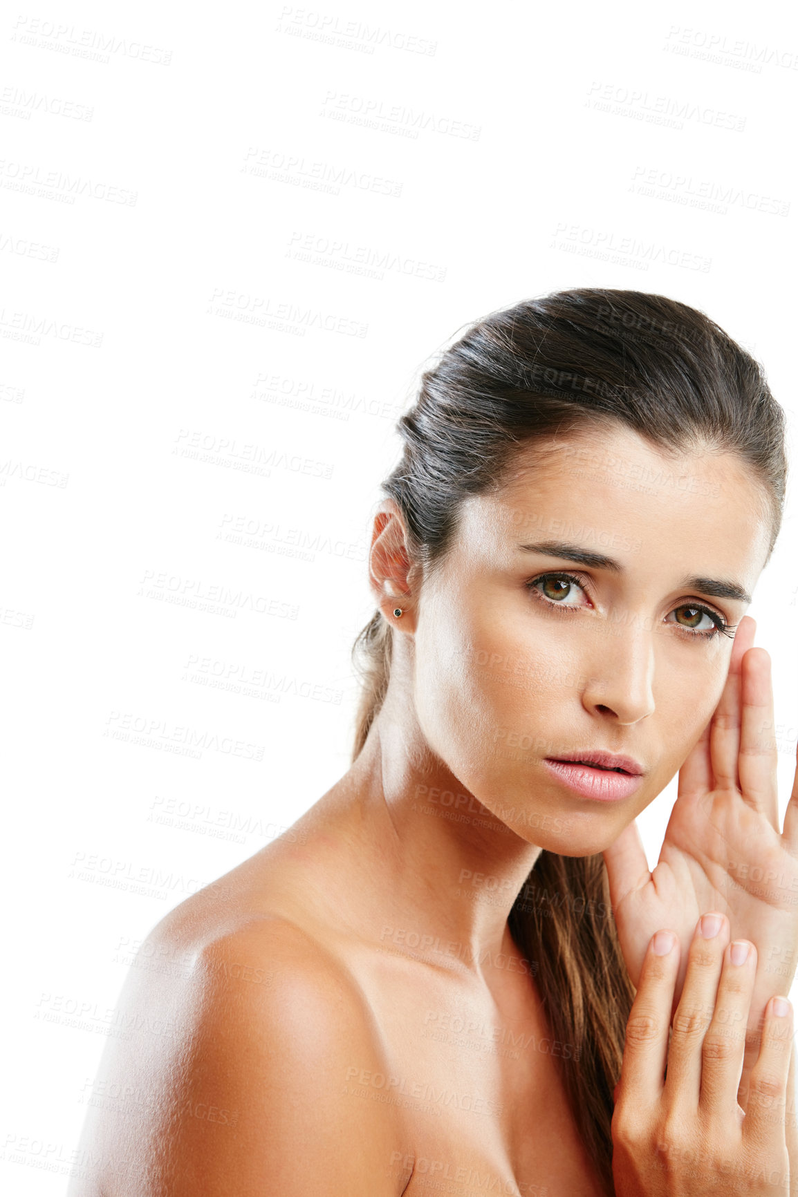 Buy stock photo Studio portrait of a beautiful young woman with a flawless complexion isolated on white