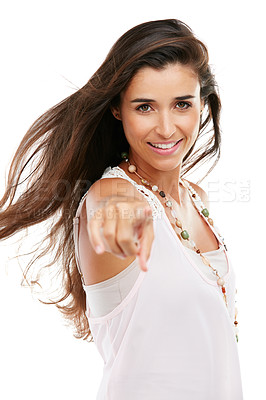 Buy stock photo Studio portrait of an attractive young woman pointing against a white background