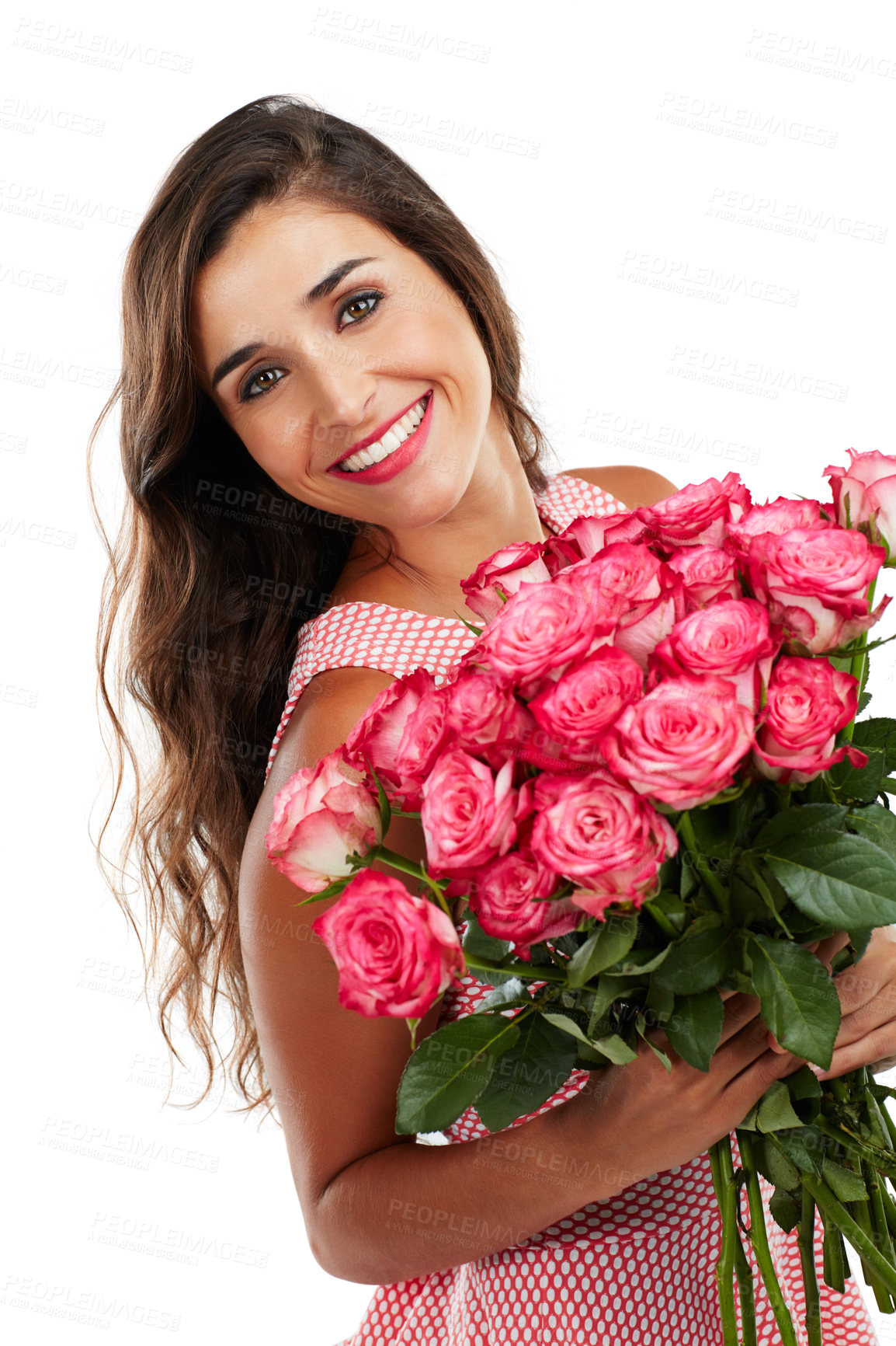 Buy stock photo Studio portrait of a happy young woman holding a bouquet of flowers against a white background