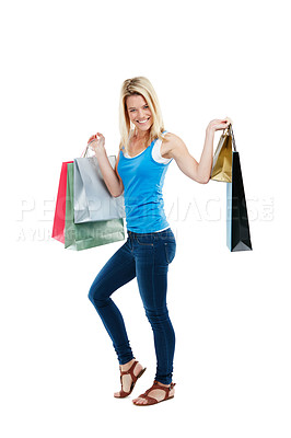 Buy stock photo Studio shot of an attractive young woman holding shopping bags