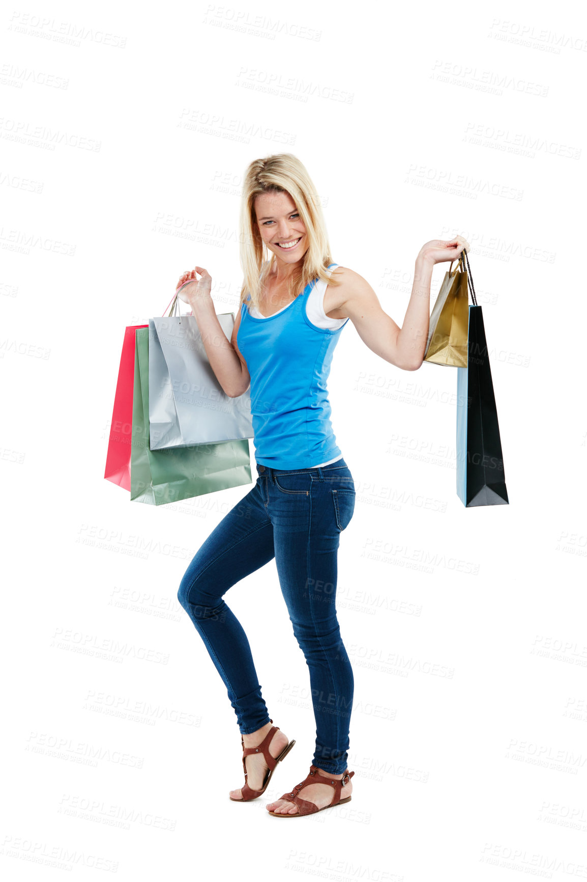 Buy stock photo Studio shot of an attractive young woman holding shopping bags