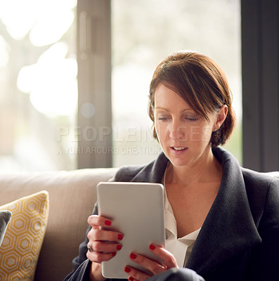 Buy stock photo Corporate woman, tablet and work from home on couch for email, conversation and communication. Female person, technology and online in morning for networking, streaming and watch series in apartment