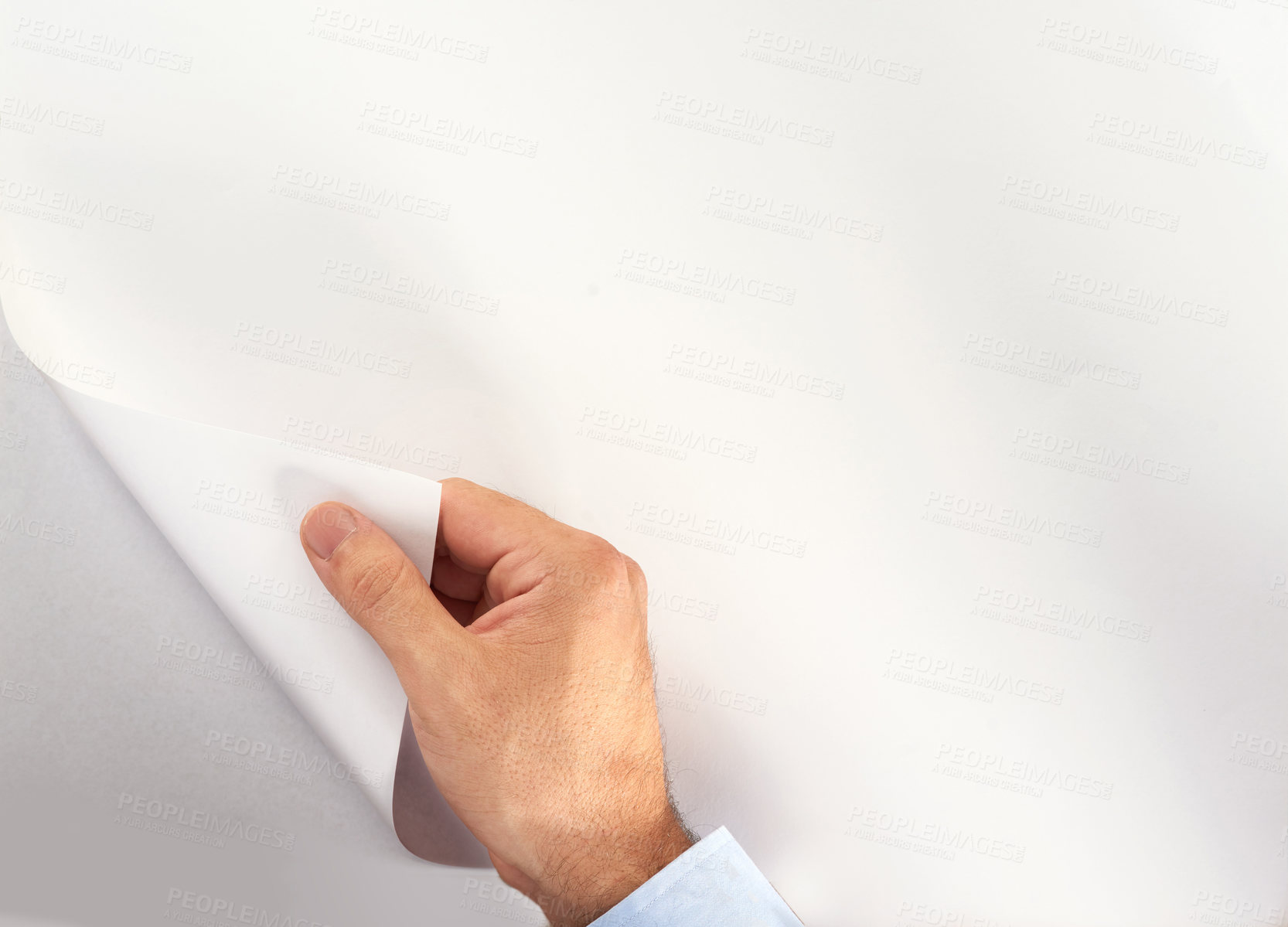 Buy stock photo Cropped shot of an unidentifiable person turning a blank page of copyspace