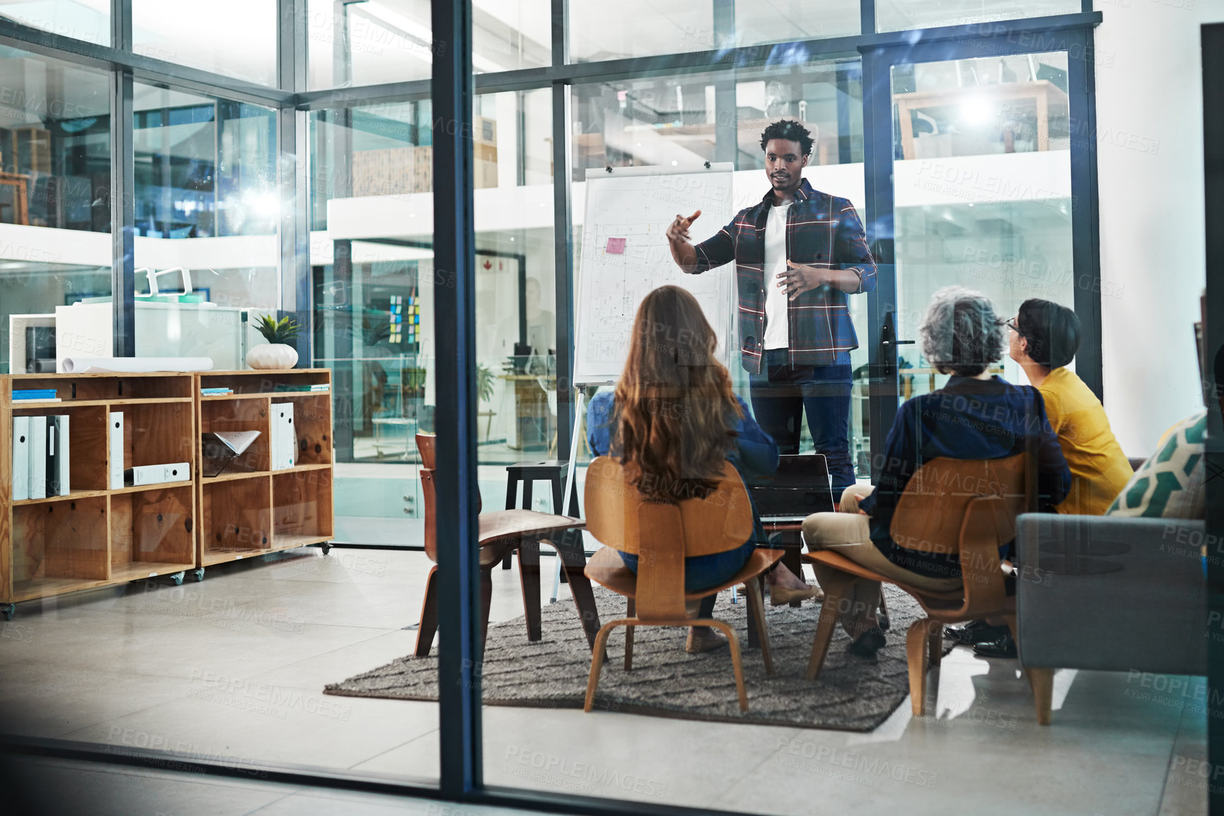 Buy stock photo Shot of a team of creative businesspeople brainstorming in the office