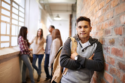 Buy stock photo Education, arms crossed and portrait of man in college hallway for studying, learning or scholarship. Future, school and knowledge with student leaning on brick wall for university, academy or campus