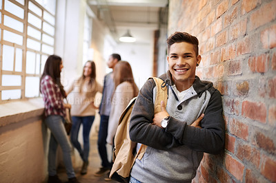 Buy stock photo Education, arms crossed and portrait of man in school hallway for studying, college and scholarship. Future, happy and knowledge with student leaning on brick wall for university, academy and campus