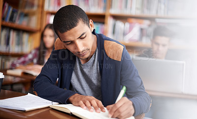 Buy stock photo Study, writing and school with man in library for education, research and classroom quiz. Focus, learning and notebook with male student on university campus for knowledge, scholarship and project