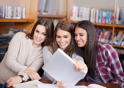 Buy stock photo Young women, students or tablet selfie in library or bonding together for support in university. Friends, technology or update on social media for profile picture or solidarity as break in college