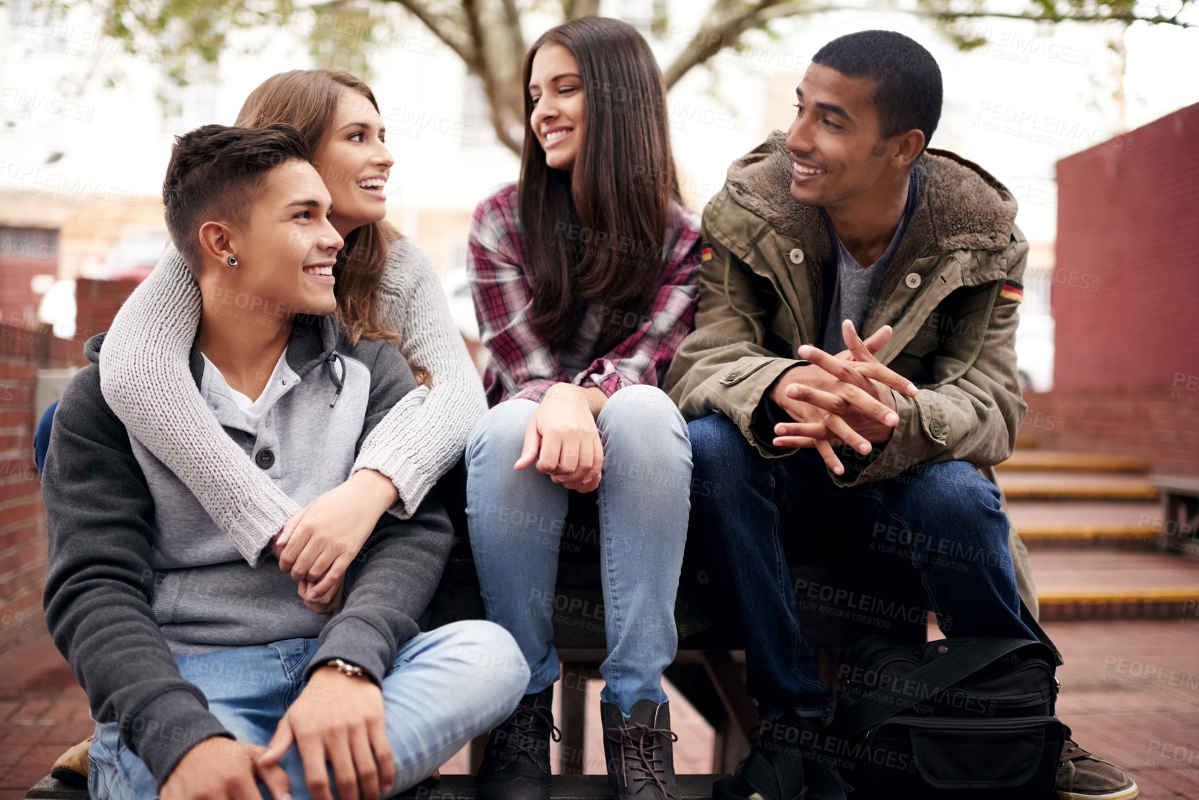 Buy stock photo University, education and friends on campus in conversation, talking and chatting outdoors. Diversity, community and happy men and women students smile for learning at school, academy and college