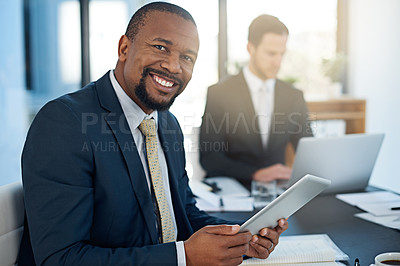 Buy stock photo Portrait of a corporate businessman working in the boardroom with a colleague in the background
