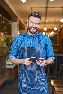 Buy stock photo Portrait of a business owner using a digital tablet in his store