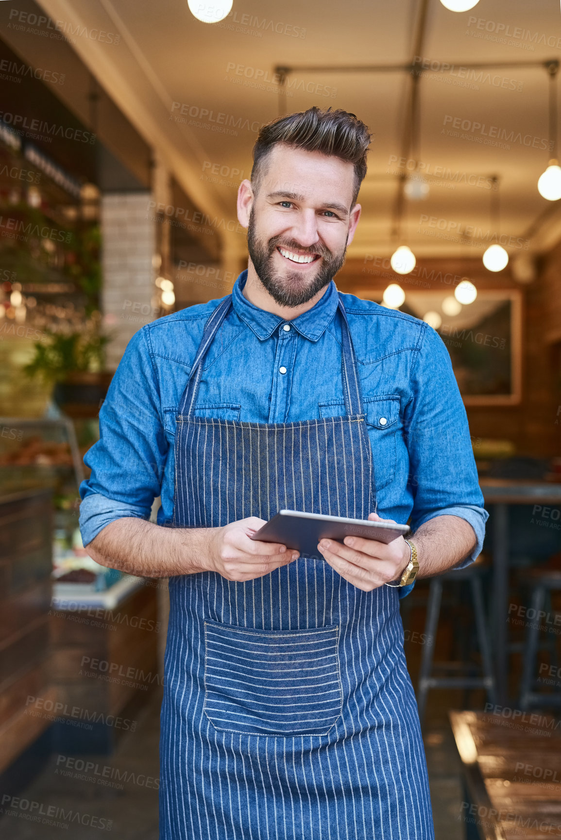 Buy stock photo Portrait of a business owner using a digital tablet in his store