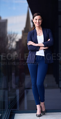 Buy stock photo Portrait of a happy businesswoman standing on a balcony with her arms crossed