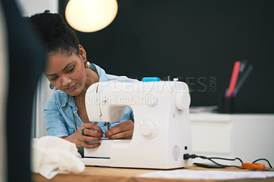Buy stock photo Shot of an attractive young fashion designer putting together a new design
