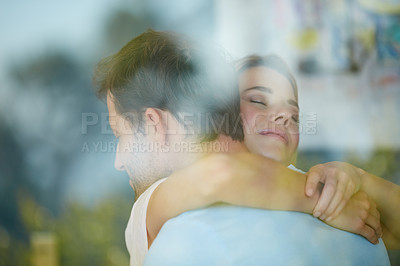 Buy stock photo Shot of a couple embracing lovingly at home