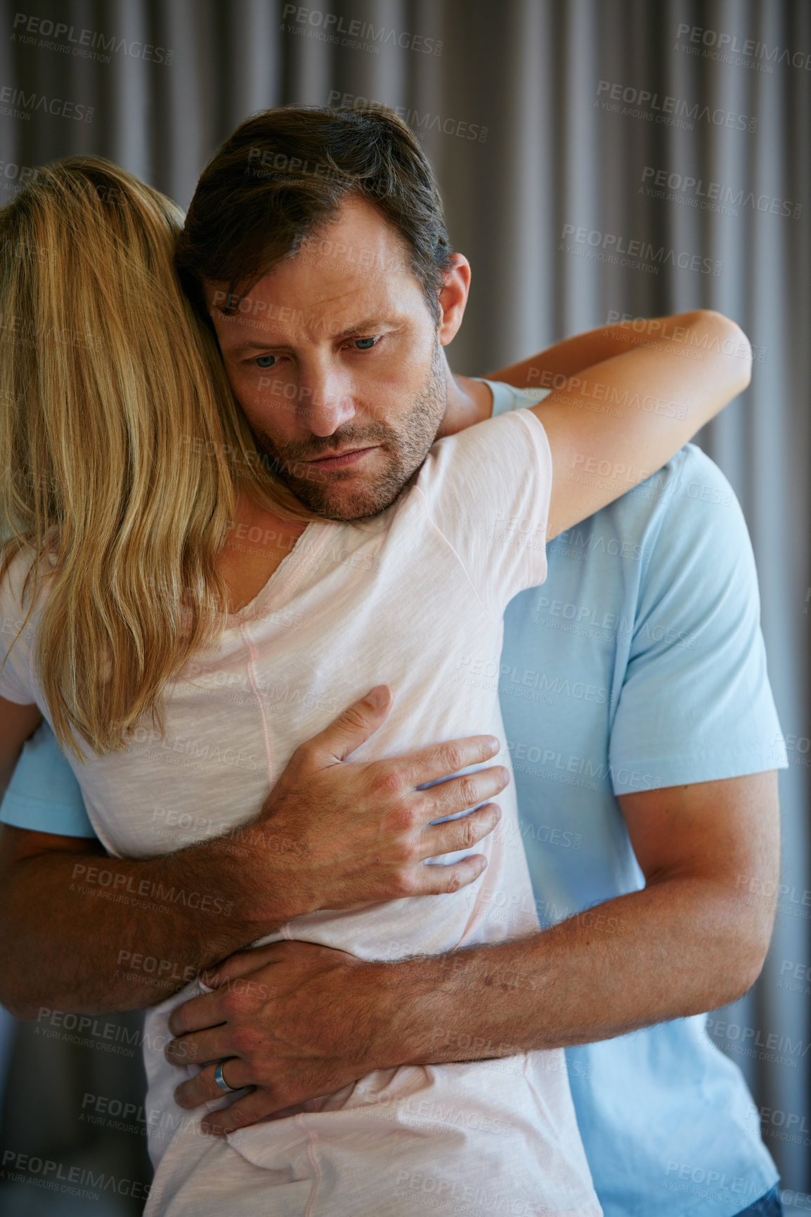 Buy stock photo Shot of a young couple supporting each other through difficulties