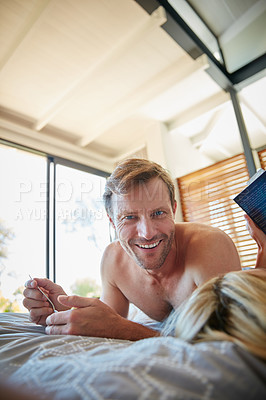 Buy stock photo Portrait of a man lying in bed with his wife