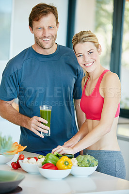 Buy stock photo Portrait of a couple preparing a nutritious meal together at home