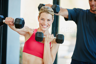 Buy stock photo Portrait of a sporty couple working out together at home