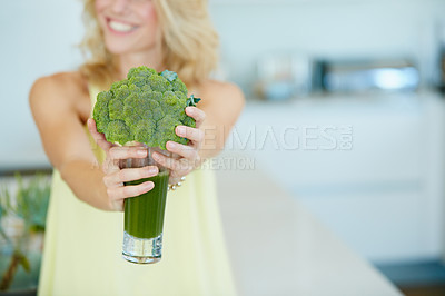 Buy stock photo Shot of a happy woman holding a broccoli  shake