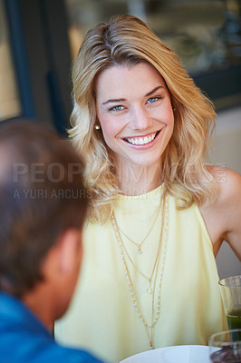 Buy stock photo Portrait of a happy young woman enjoying a meal with her husband at home