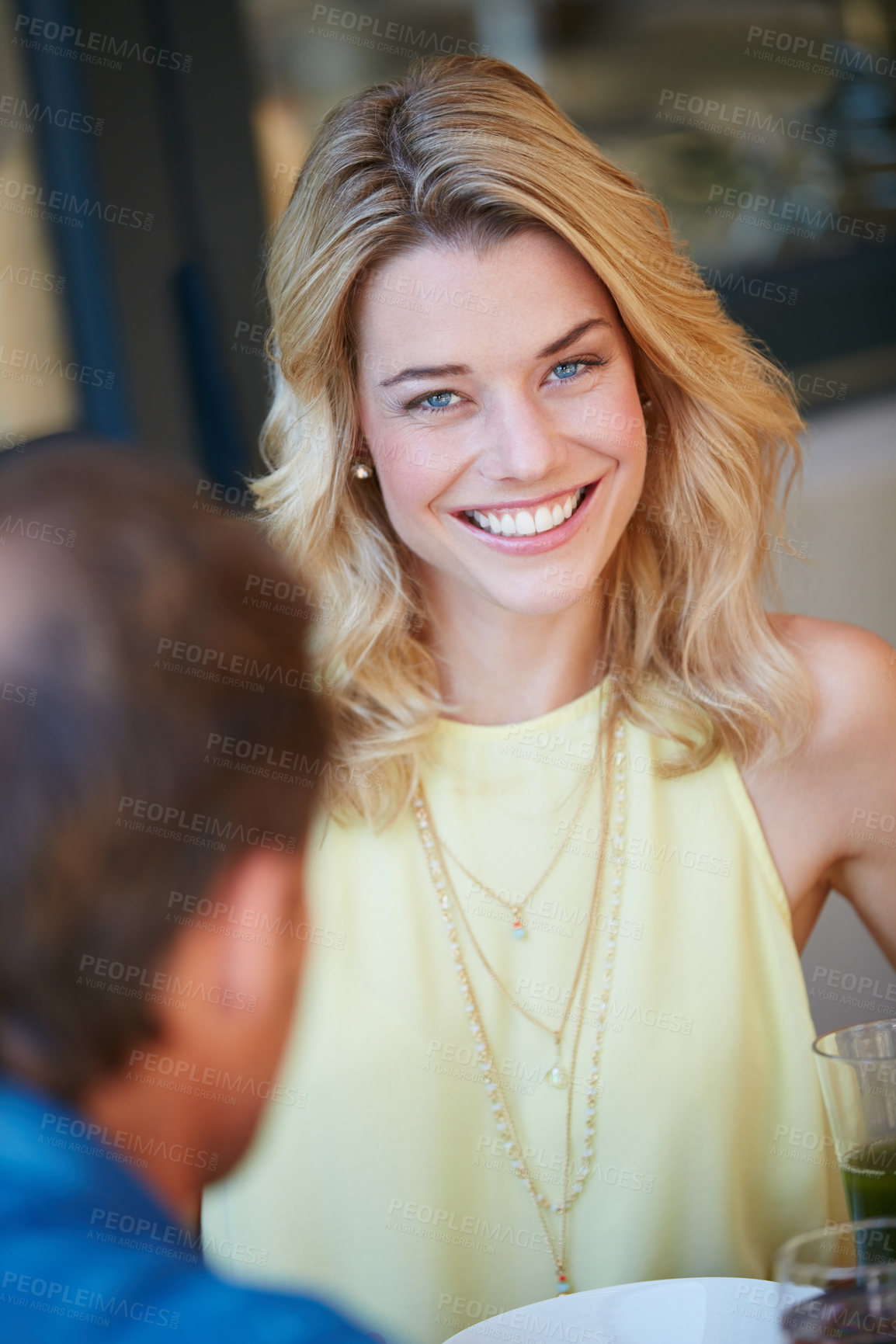 Buy stock photo Portrait of a happy young woman enjoying a meal with her husband at home