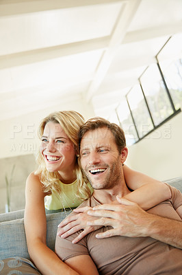 Buy stock photo Shot of a happy couple enjoying some free time together at home