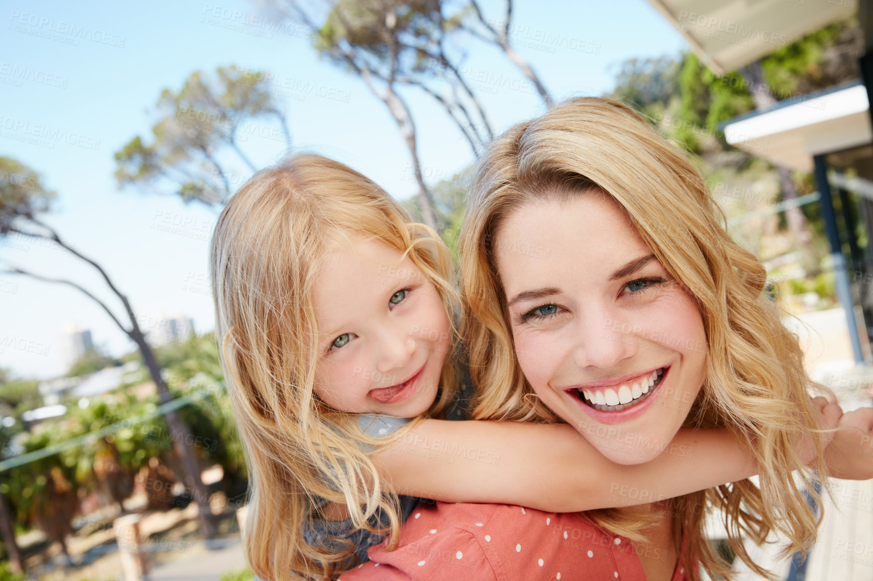 Buy stock photo Portrait of a mother and daughter spending quality time together outside