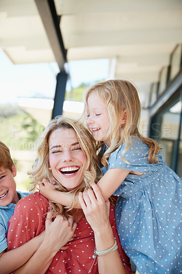 Buy stock photo Cropped shot of a mother bonding together with her two children outside