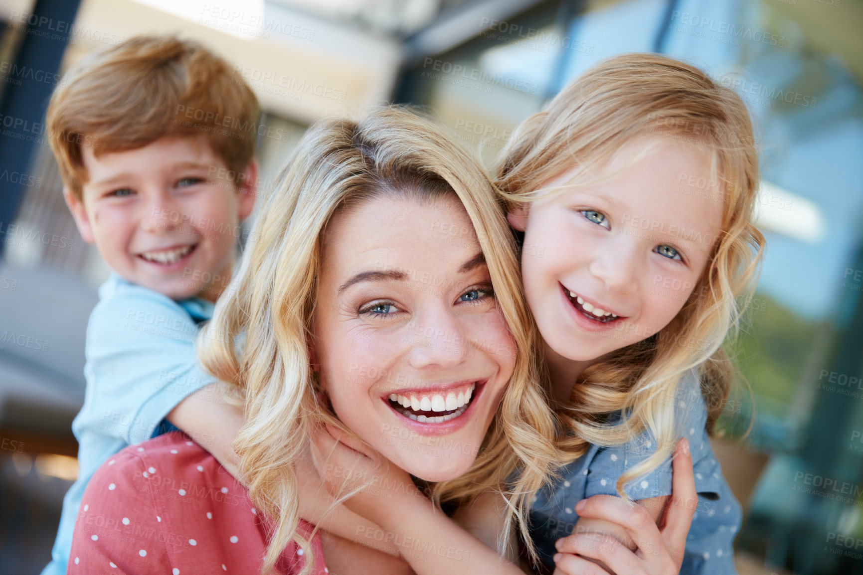 Buy stock photo Portrait of a mother and her two children spending quality time together outside