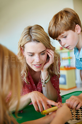 Buy stock photo Cropped shot of a mother having fun with her two kids at home